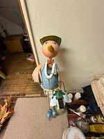 Metal bird statue holding lantern