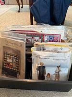 Box of assorted sewing and craft patterns including McCall's 2340 and Cat Cottage Pillow