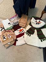 Group shot of rugs, towels and hooks