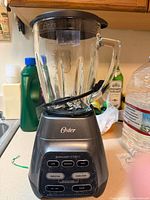 Full view of Oster blender with glass jar and base