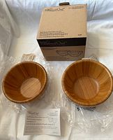 Front view of boxed set showing two bowls in plastic wrap, box, inserts