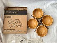 Box and four bamboo bowls displayed