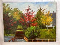 Front view of oil painting showing autumn trees, wooden steps and waterway