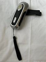 Front view showing Lightmates logo, LED lens, wrist strap