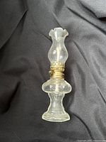 Full view of glass oil lamp upright