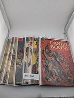 Stack of bagged Dell western comics showing Daniel Boone on top