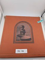 Front of orange slipcase with child image