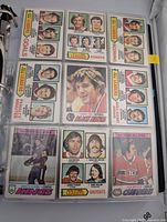 Binder page showing 9 league leader and All-Star cards