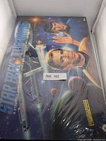 Front of sealed 1992 Star Trek board game showing characters Kirk and Spock, shrink-wrap tears visible
