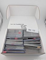 Box showing rows of sleeved NBA cards