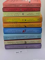 Spine view of all nine books stacked