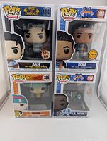 Front view of all four boxed Funko Pop figures
