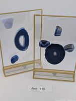 Two agate slice displays with gold frames