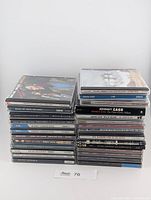 Two stacks of jewel-case CDs, 27 in total