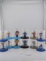 All 12 Domez figures stacked two high