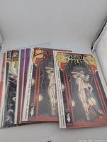 Stack of bagged Donna Mia issues showing red variant and duplicates