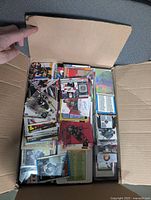 Open box showing stacks of assorted NHL cards