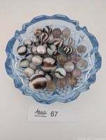 Top view of entire marble collection in blue dish