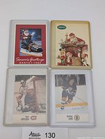 Front view of all four cards in sleeves