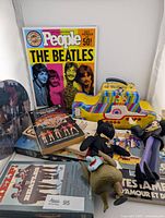 Group shot: magazine, lunchbox, figures, booklets, video