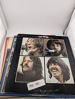 Front cover of Let It Be on top of album stack