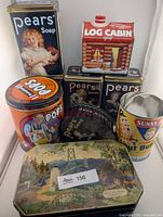 Group shot of nine vintage advertising tins