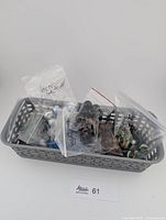 Basket containing multiple bags of assorted marbles