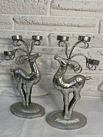 Both metal reindeer candle holders front view