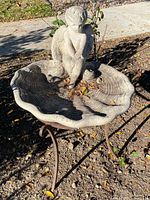 Full view of bird bath on stand