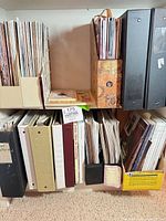 Shelf section showing magazines, binders, magazine files