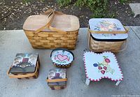 All six baskets showing relative sizes and painted lids