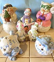 Group shot of all seven ceramic snowman items