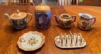 Group shot of all six lusterware pieces on table