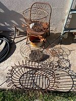 Group shot showing all rusted metal baskets, trays, plant stand, ring and pot