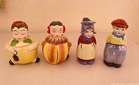 Group of four vintage ceramic condiment jars/shakers