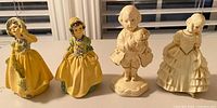 Group shot of all four chalkware figurines