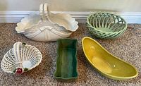 All five vintage ceramic baskets and dishes arranged on carpet