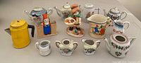 Overall lot showing all miniature teapots, creamers, figurines, toothpick holder