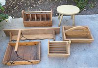 Overview of five wooden pieces and stool on concrete