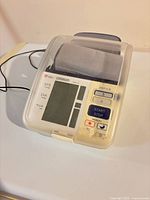 front view of Omron blood pressure monitor with display and cover
