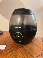 Front view of Honeywell humidifier showing tank, control dial and indicator