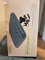 Retail box displaying Everyday Essentials double inflatable air mattress and pump