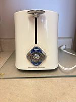 Front view of white Hamilton Beach 2-slice toaster with chrome controls