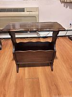 Front view of wooden magazine holder side table