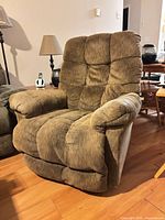 Front view of brown upholstered recliner upright