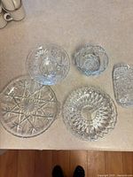 Group view of five pressed glass serving pieces