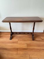 Full frontal view of wood console table