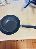 Top view of small nonstick wok showing interior and handle
