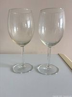Pair of clear wine glasses with plain stems
