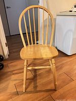 Front view of solid wood spindle back dining chair